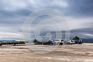 Cars parking under alpine mountain in Austria