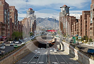 Cars Passing Through Navvab Tunnel of Tehran with Milad Tower in the Background