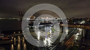 Cars passing at night near the Port of Vancouver in Downtown Vancouver British Columbia.