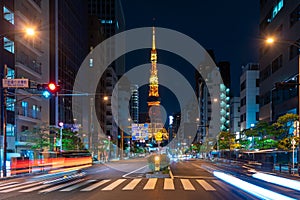 Cars and Pedestrian walking on Street Scene of Traffic at Tokyo tower crossing in Tokyo