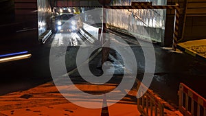 Cars in queue at entrance in underground parking of hypermarket time lapse