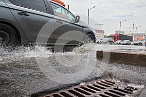 Cars ride through puddles after rain