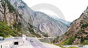 Cars riding on mountain serpentine in Alps, Switzerland.