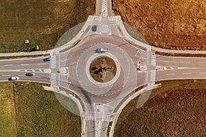 Cars on road intersection roundabout