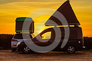 Cars with roof top tent camp on beach