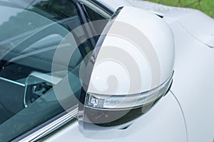 Cars run through the street from the white cars side view mirror. City beside. Road Car Rear View Mirror Motion Blur Background