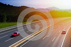 Cars rushing along a high-speed highway in the sun, city of San Sebastian