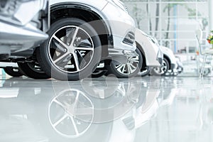 Cars For Sale, Automotive Industry, Cars Dealership Parking Lot. Rows of Brand New Vehicles Awaiting New Owners, on the epoxy