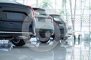 Cars For Sale. Automotive Industry. Cars Dealership Parking Lot. Rows of Brand New Vehicles Awaiting New Owners in the showroom