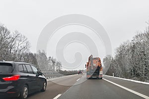 Cars and special purpose vehicle for wet waste disposal on an autobahn, Germany