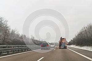 Cars and special purpose vehicle for wet waste disposal on an autobahn, Germany