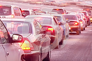 Cars stand before the trafficlight. photo