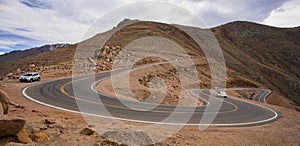 Cars on the steep, winding road up Pikes Peak, Colorado