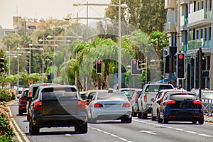 Cars stopped at a red traffic light