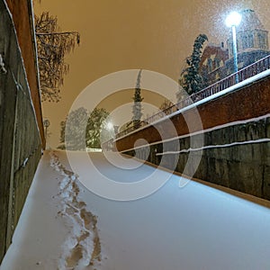 Cars and streets covered in snow in night image of Filomena storm fall in Madrid Spain. Winter photo