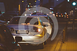 Cars traffic jam in the city by night