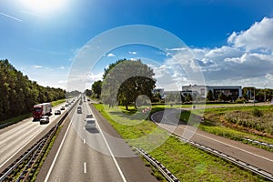 Cars and trucks driving on the A44 highway near Sassenheim