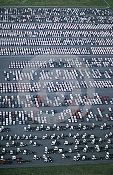 Cars and trucks parked in carpark view from above