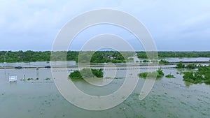 Cars and trucks trying to drive through flooded i45 near Houston Texas