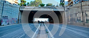 Cars tunnel in a street