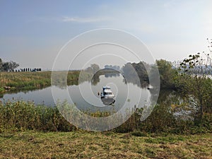 Carska bara Zrenjanin wildlife nature reserve lake with boat photo
