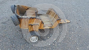 Cart built with burnt matches sticks and toy car wheels