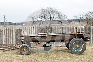 Cart with chickens in the village courtyard