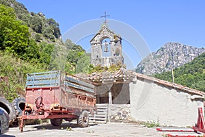 Cart in front of a church in a village