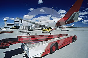 Cart near aeroplane at airport Perth Australia