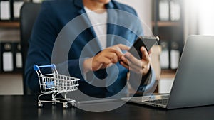 Cart Online Shopping concept. businessman hand using smart phone, tablet payments and holding credit card online shopping, omni