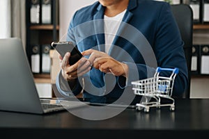 Cart Online Shopping concept. businessman hand using smart phone, tablet payments and holding credit card online shopping, omni