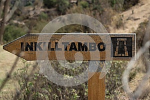 Cartel that indicates the location of the Inkilltambo archaeological center in Cusco photo