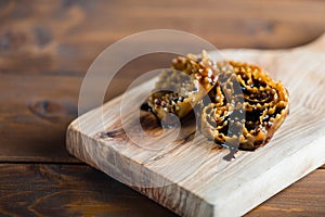 Cartellate, traditional italian pastry with syrup photo