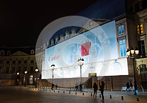Cartier advertisement on a renovation site, Place Vendome square, Paris, France