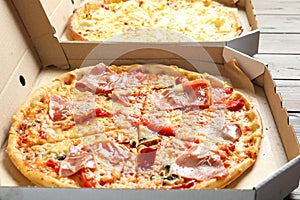 Carton boxes with delicious pizzas