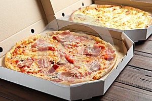 Carton boxes with delicious pizzas