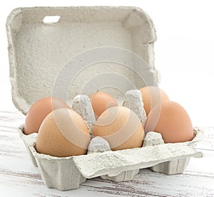 Carton of brown free range eggs.