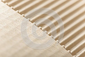 Carton or cardboard packing material. Texture of corrugated paper sheets made from cellulose. Supplies for creating boxes.