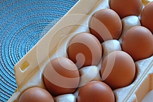 Carton of frech eggs in close-up and top-view 2