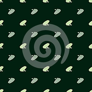 Cartoon animal aquatic seamless pattern with blue and green little frog silhouettes on dark background