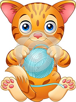 Cartoon baby cat playing with ball of blue yarn