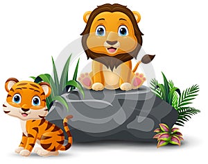 Cartoon baby lion and tiger sitting on the stone