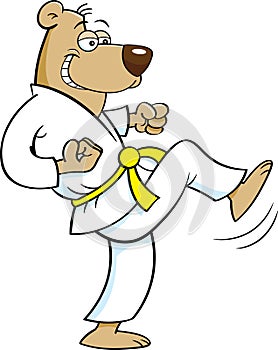 Cartoon bear in a Karate uniform kicking.
