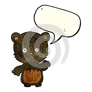 cartoon black bearcub waving with speech bubble