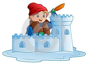 Cartoon boy in winter clothes building a snow fortress