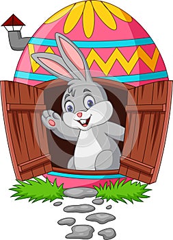 Cartoon bunny with decorated Easter eggs house