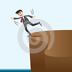 Cartoon businessman risky on cliff photo