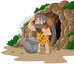 Cartoon caveman inventing stone wheel with cave background photo