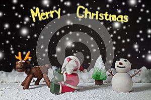 Cartoon character for Christmas season on background is dark with snow at nitght
