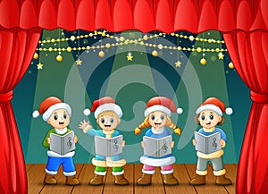 Cartoon children singing christmas carols on the stage